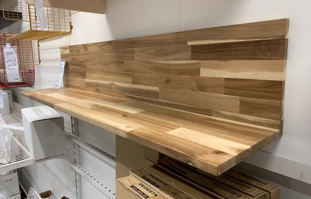 Wooden wall shelf hanging in IKEA store